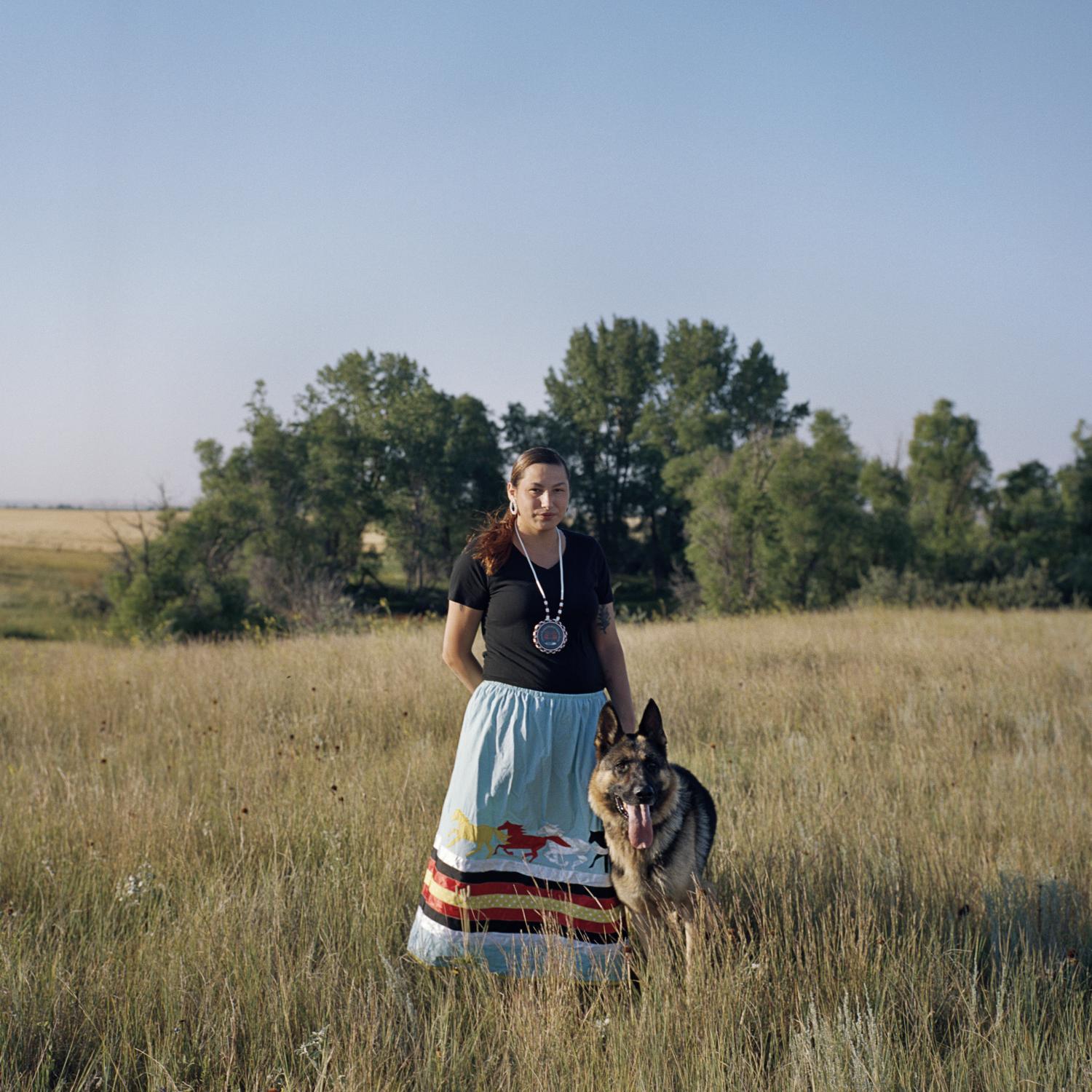 The Bakken oil shale's impact on Native American women - Heather Belgrade, 23, with her dog, Vador, near her home...