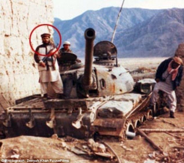 Circled, stands atop a Soviet t... fighting jihad in Afghanistan 