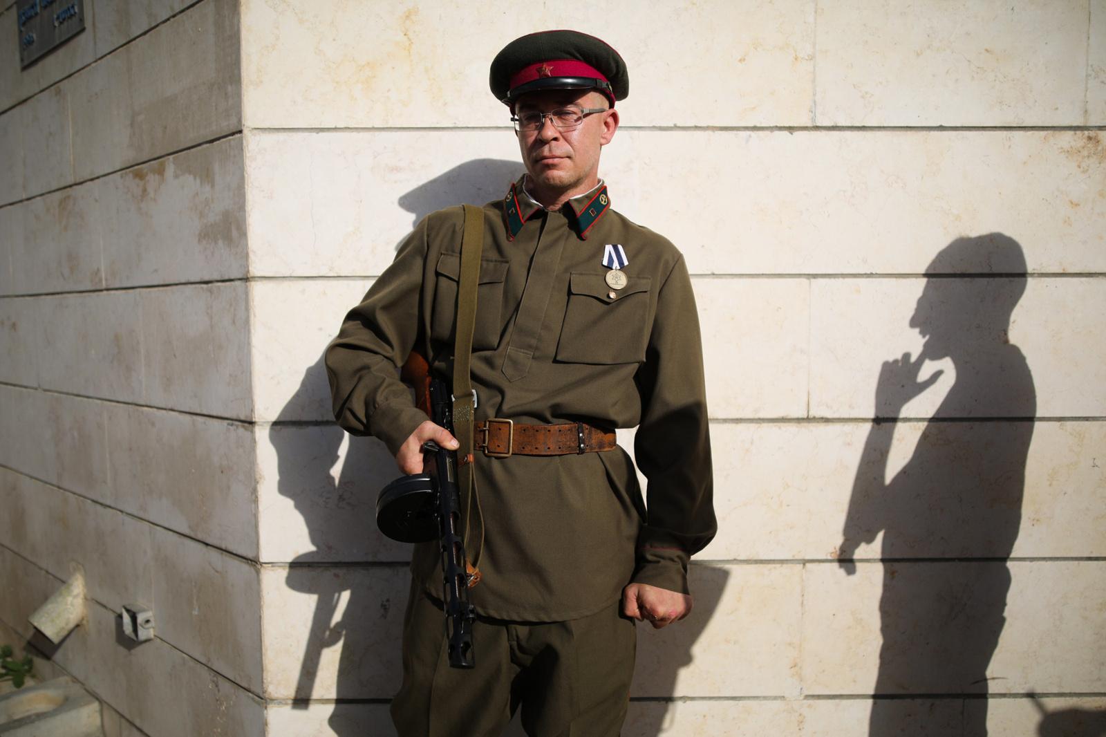 A man wearing a Red Army uniform is seen during an event in remembrance of Victory Day, marking...