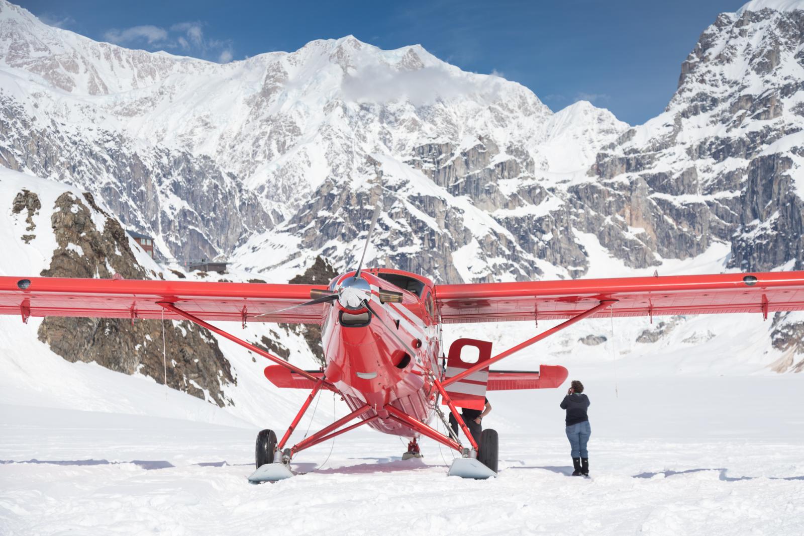 A flightseeing passenger takes ... skis on this glacial airstrip.