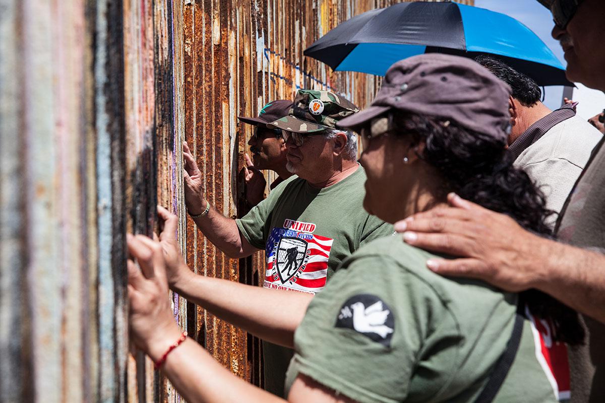 Veterans at the border fence in Playas de Tijuana, Mexico to visit loved ones that are in the...