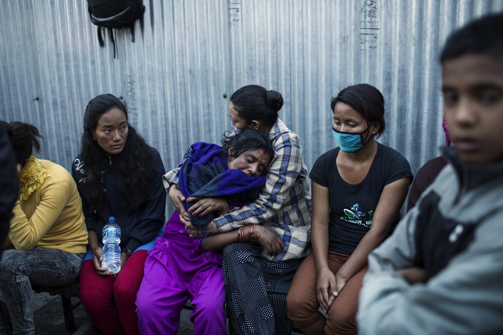 Nepal: Aftermath - Relatives of the victims of the earthquake mourn their...
