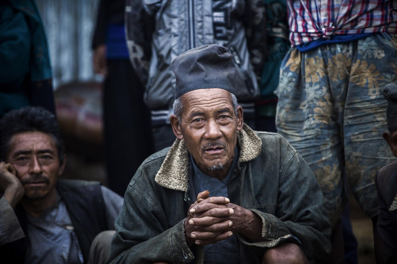 Nepal: Aftermath - Nepal / Natural disaster / A Nepalese is seen waiting for...