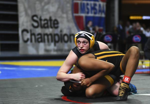 Rock Bridge&#39;s Anna Stephens puts Seraphina Blackmon of Lafayette High School, Wildwood, in a hold at the MSHSAA wrestling tournament on Friday, Feb. 21, 2020, at the Mizzou Arena. In the quarterfinal, Stephens won by decision over Blackmon.