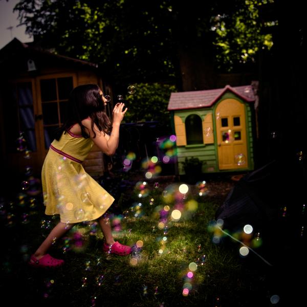 Image from The house on the moon. Children's dreams in covid-19 lockdown - Catching bubbles in our garden