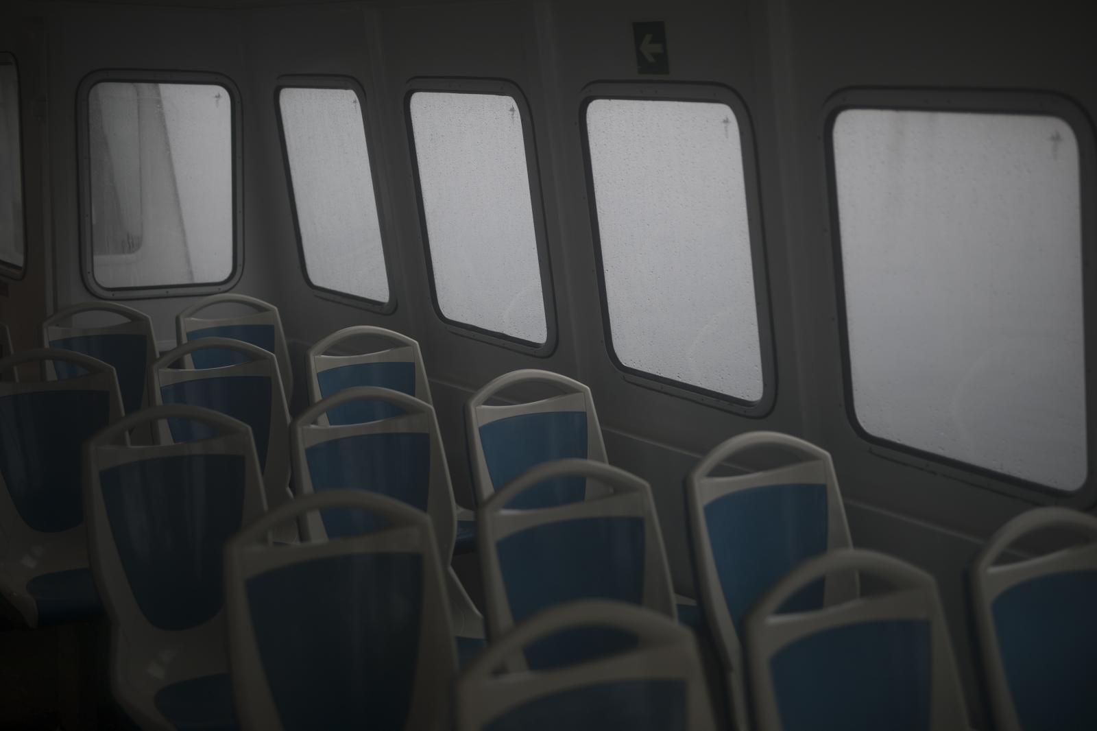 Seats lie empty on a deserted f...ts only. (AP Photo/Daniel Cole)