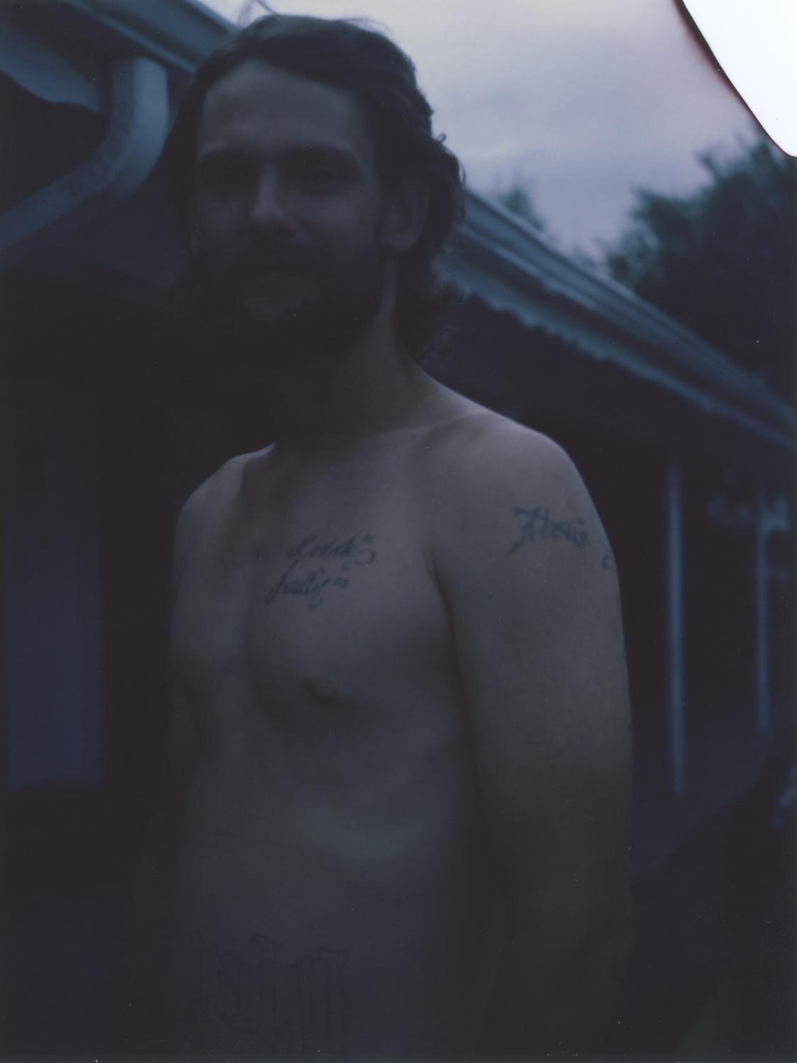 Mark, 32 years old, at the parking lot of a road motel in Colfax Avenue, where he was resting for...