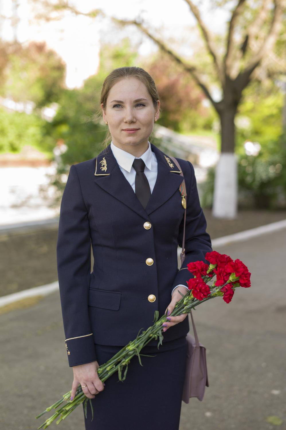  Anastasia poses for a portrait before the parade, wearing her uniform of the Transnistrian...