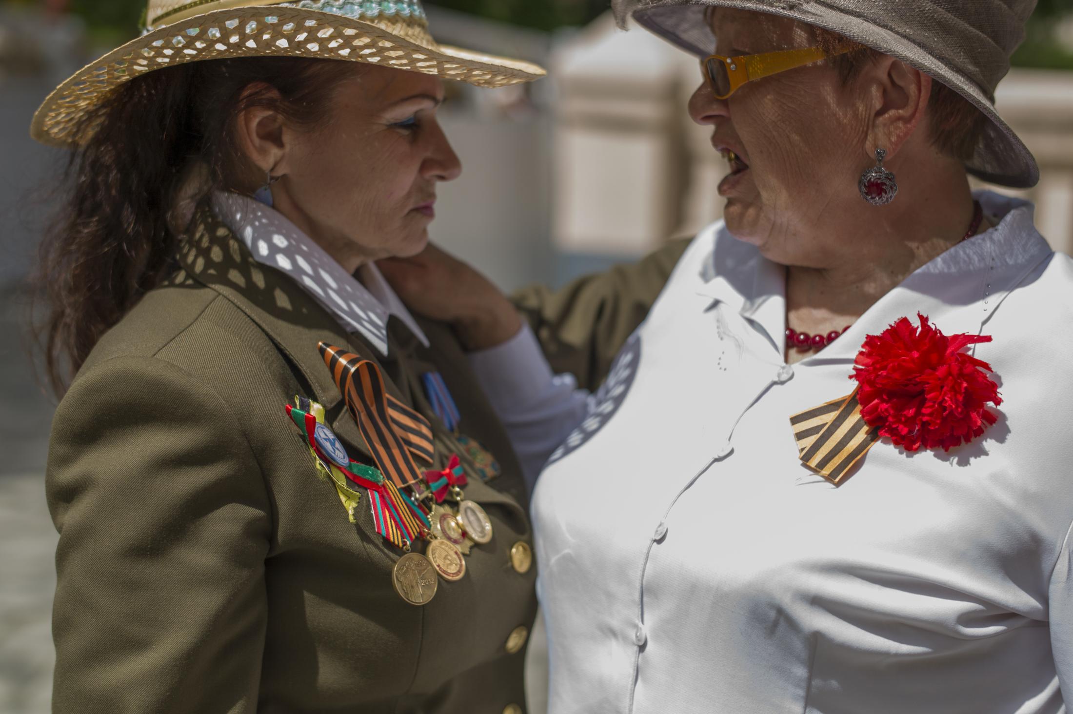  Cristina (L), a nurse who lives in Bender, recalls how she was helping wounded soldiers during...
