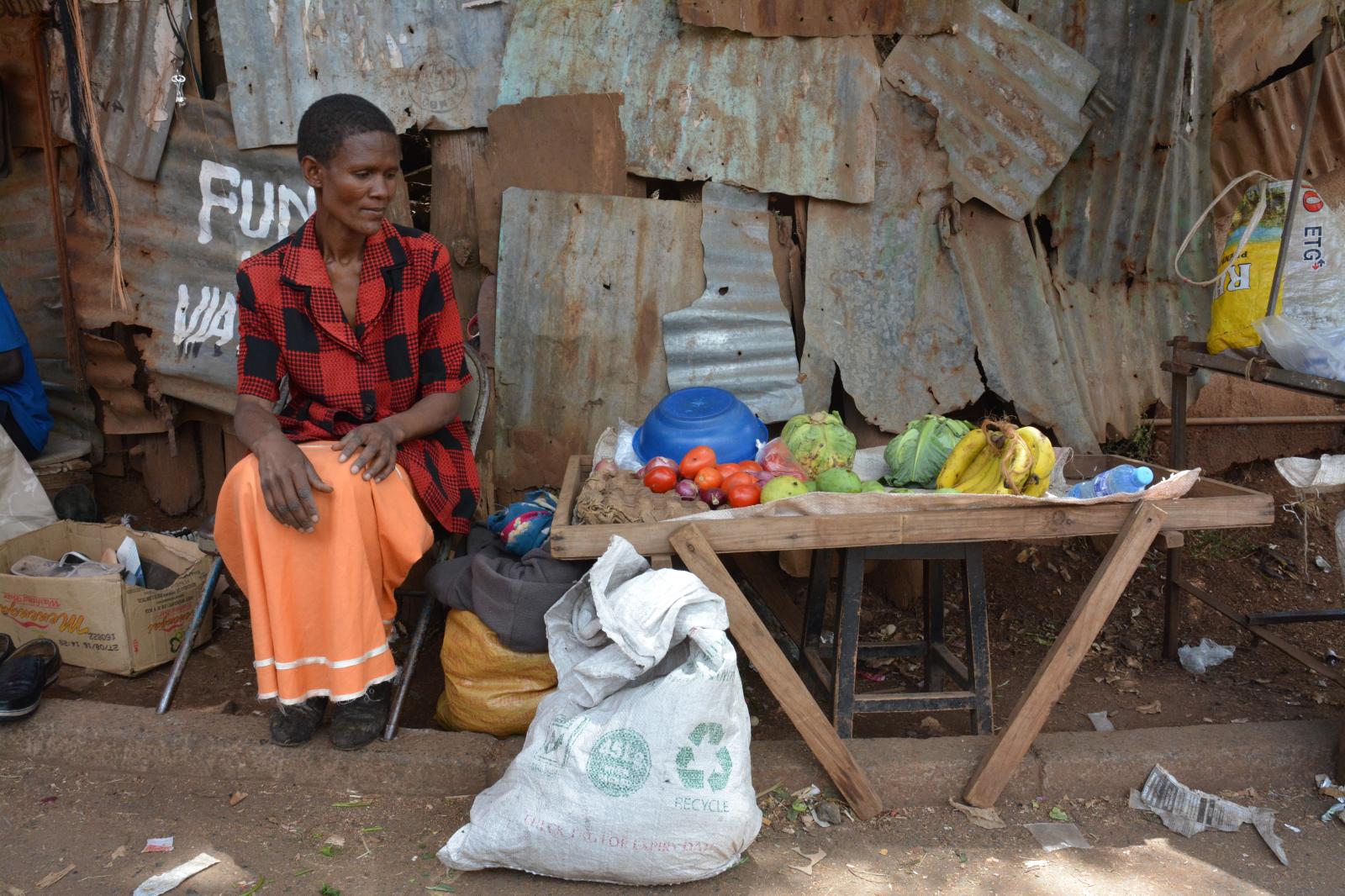 Mother selling produce in Kibera, Nairobi, Kenya.