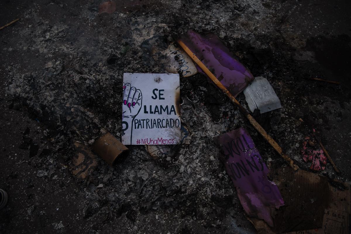 Part of a sign reading &quot;It&#39;s called patriarchy&quot; is seen in a burnt pile in Zocalo square during International Women&#39;s Day protest in Mexico City, Mexico March 8, 2020.