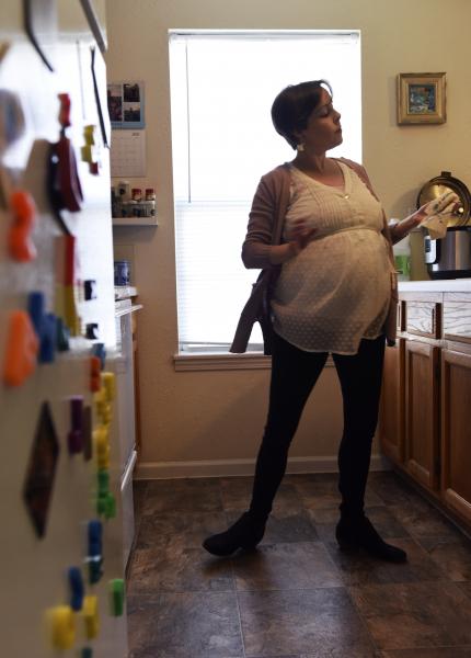 Expecting mother Rachel Long cleans her home on Tuesday, April 14, 2020, in her home. She began maternity leave on Monday. &ldquo;It feels weird to be home by myself,&rdquo; Long said. &ldquo;But it does give me a chance to clean up a bit before my 4-year-old gets home from pre-school.&rdquo;