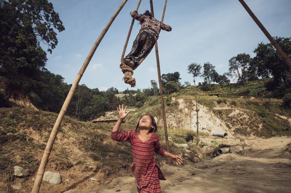 Image from NEPAL, FOREVEREST - Children playing with a homemade seasaw in Kagati...