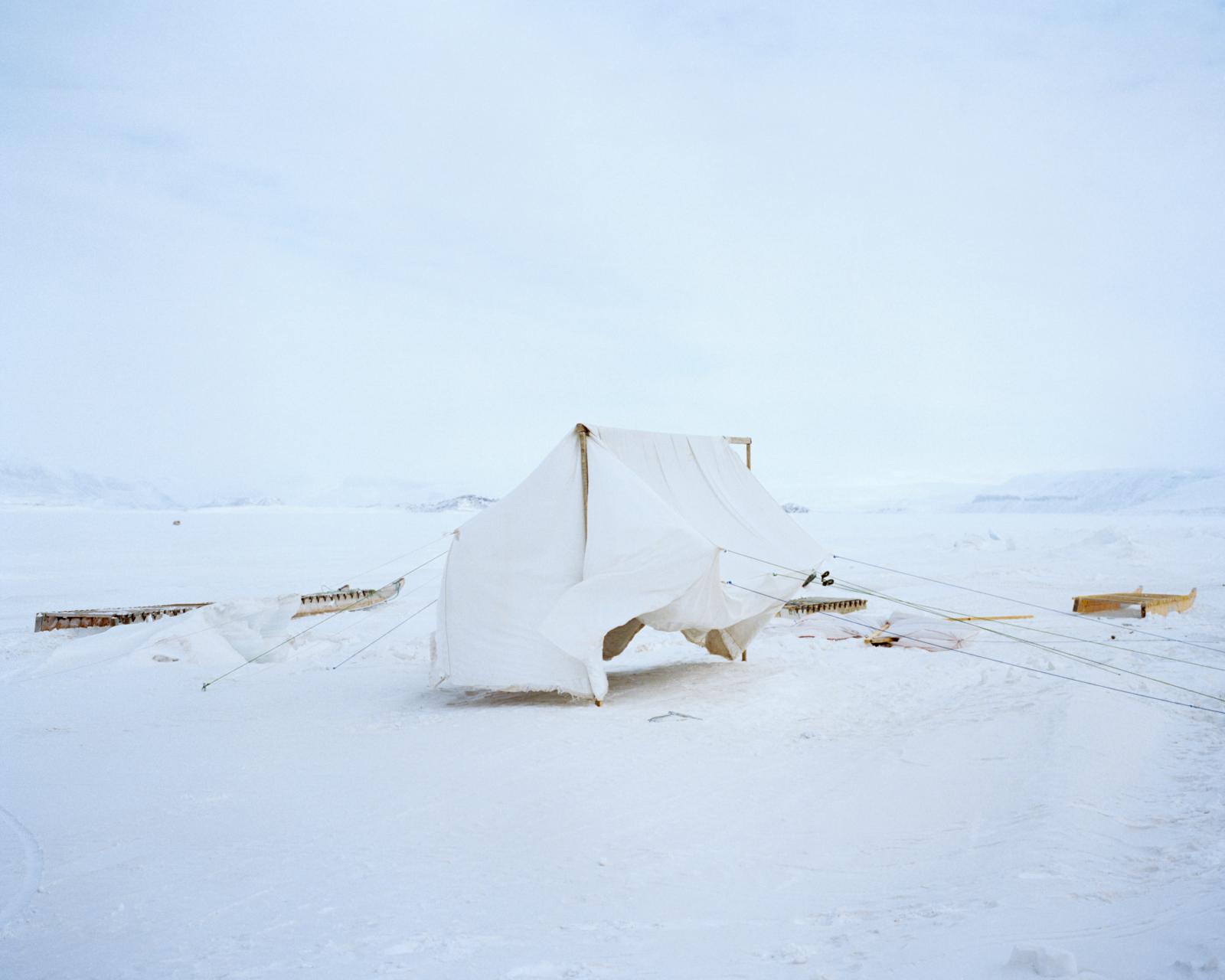 Before a camping trip, a homema...ries on the sea ice in Nunavut.
