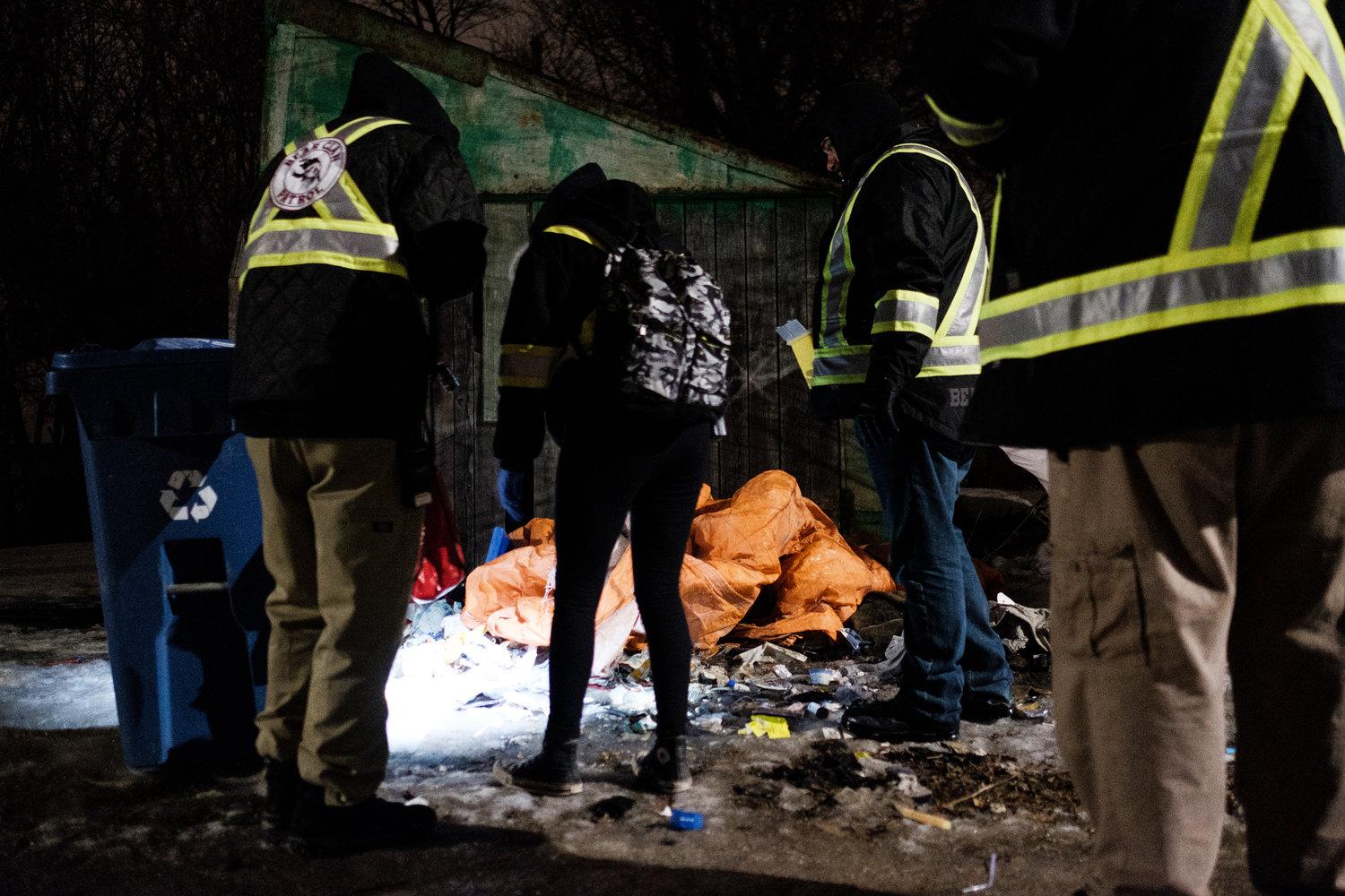 Bear Clan Patrol - Patrols search through garbage left on the ground,...