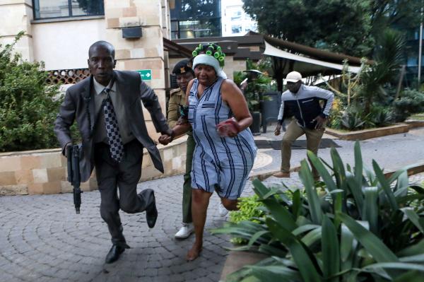 Daniel Irungu | Kenya Nairobi Explosion  - Kenyan plain clothed police officers rescue a woman to...
