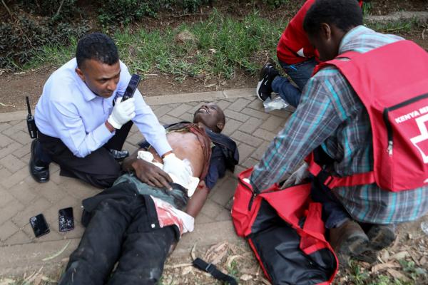 Daniel Irungu | Kenya Nairobi Explosion  - Kenyan RedCross workers provide first aid services to...