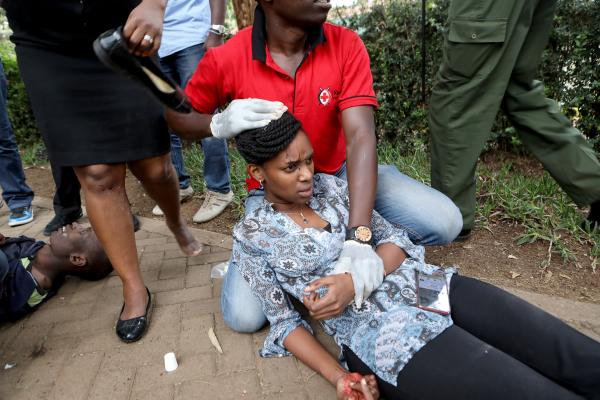 Daniel Irungu | Kenya Nairobi Explosion  - Kenyan RedCross workers provide first aid services to...
