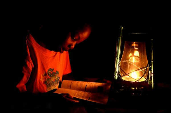 Image from 2012 DAILY LIFE CATEGORY WINNERS -  Martin Jjumba  3rd Place, Daily Life  A boys studying...