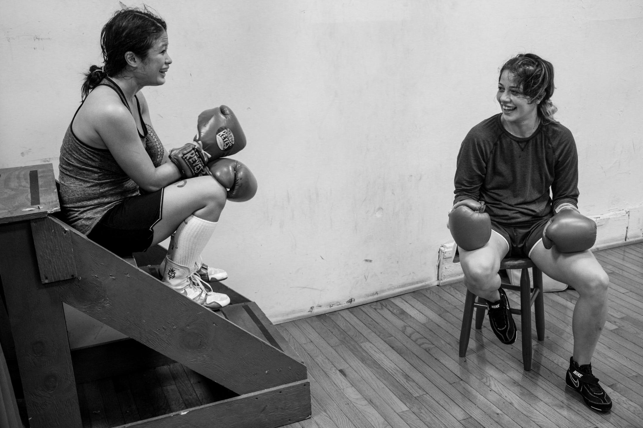 Fight Like a Woman - In between sparring, Casey shares a laugh with another...
