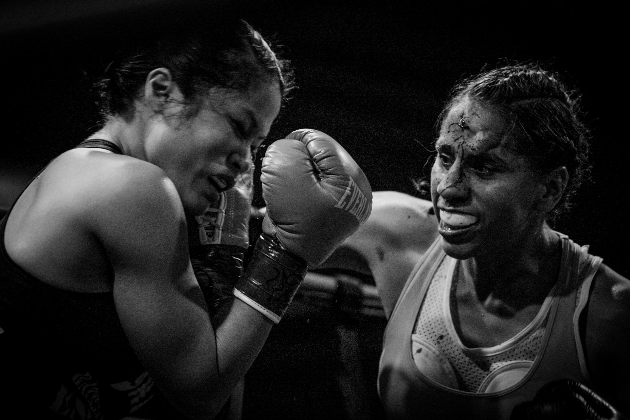 Fight Like a Woman - Blanca Raymundo, right, delivers a punch to Casey Morton...