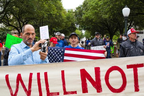 Image from Recent - Demonstrators hold signs during a 'You Can't...