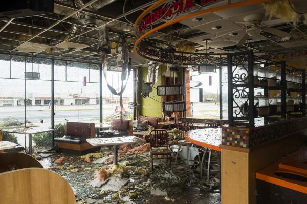 Image from Recent - The inside of a Popeyes restaurant is seen damaged from...
