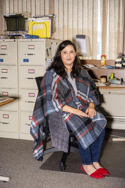 Image from Portraits - Managing Editor Sarah Scull sits in the office of the...