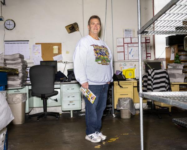 Portraits - Publisher Rich Paulsen stands in the printing press room...
