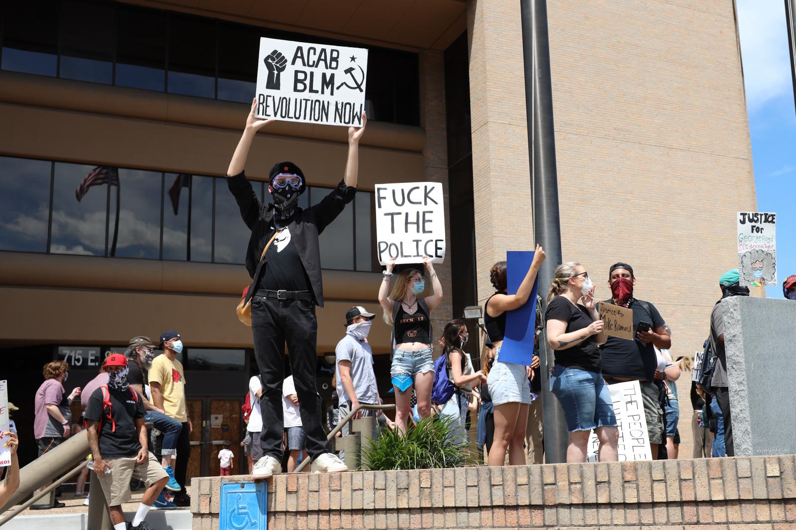 Protesters rally midday at the ...e Headquarters on May 30, 2020.