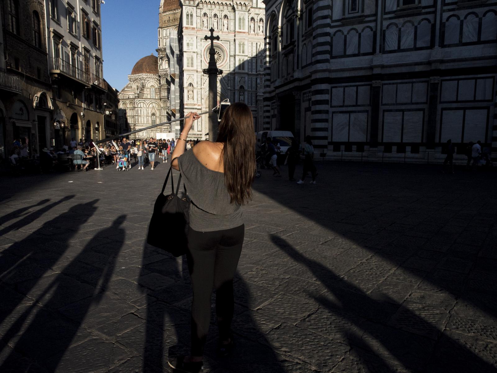 Florence, Italy August 26th 201...g a selfie in Piazza del Duomo.