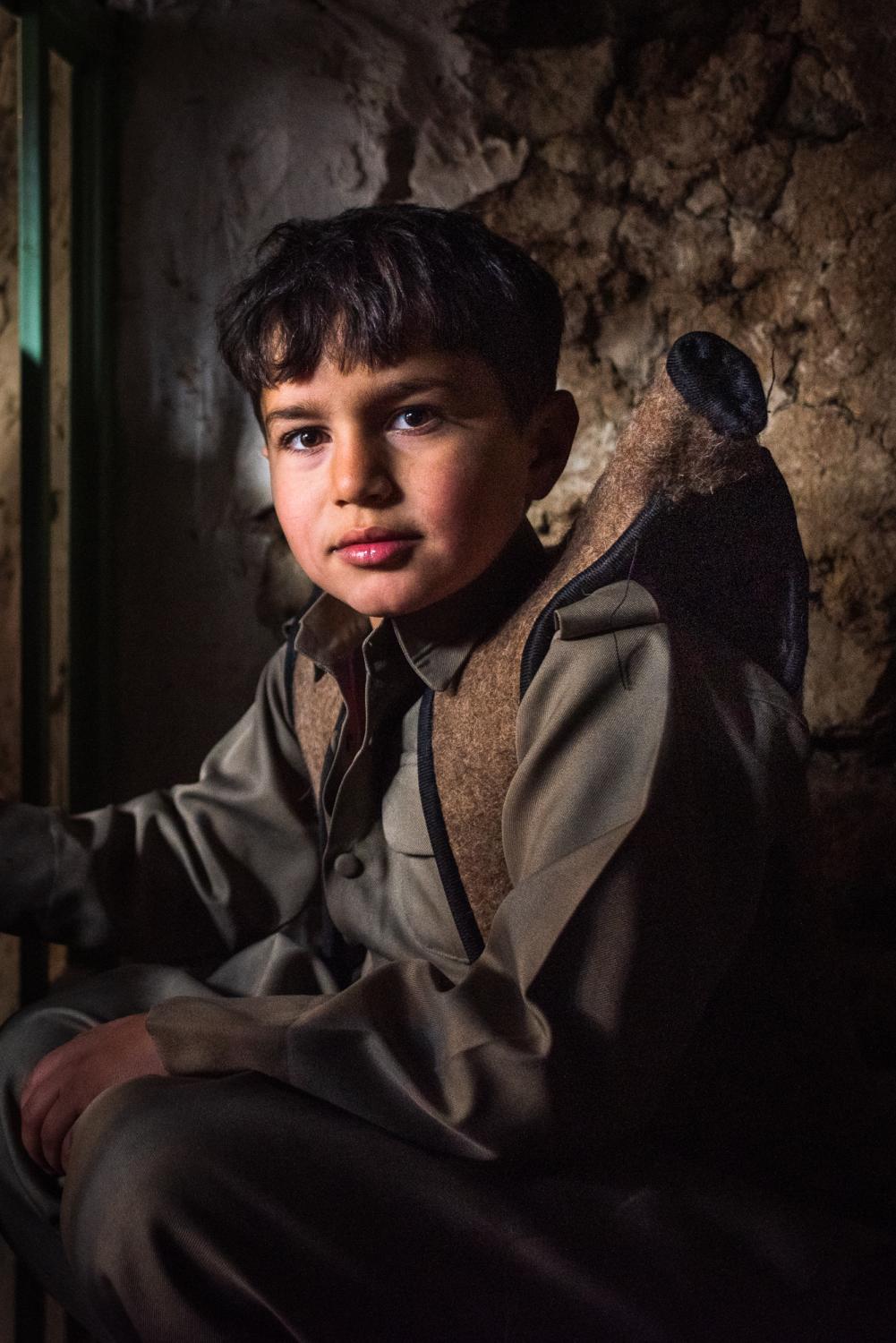 HEWRAMAN-TAKHT, IRAN &ndash; JANUARY 30, 2019: A Kurdish boy wearing traditional Kurdish...