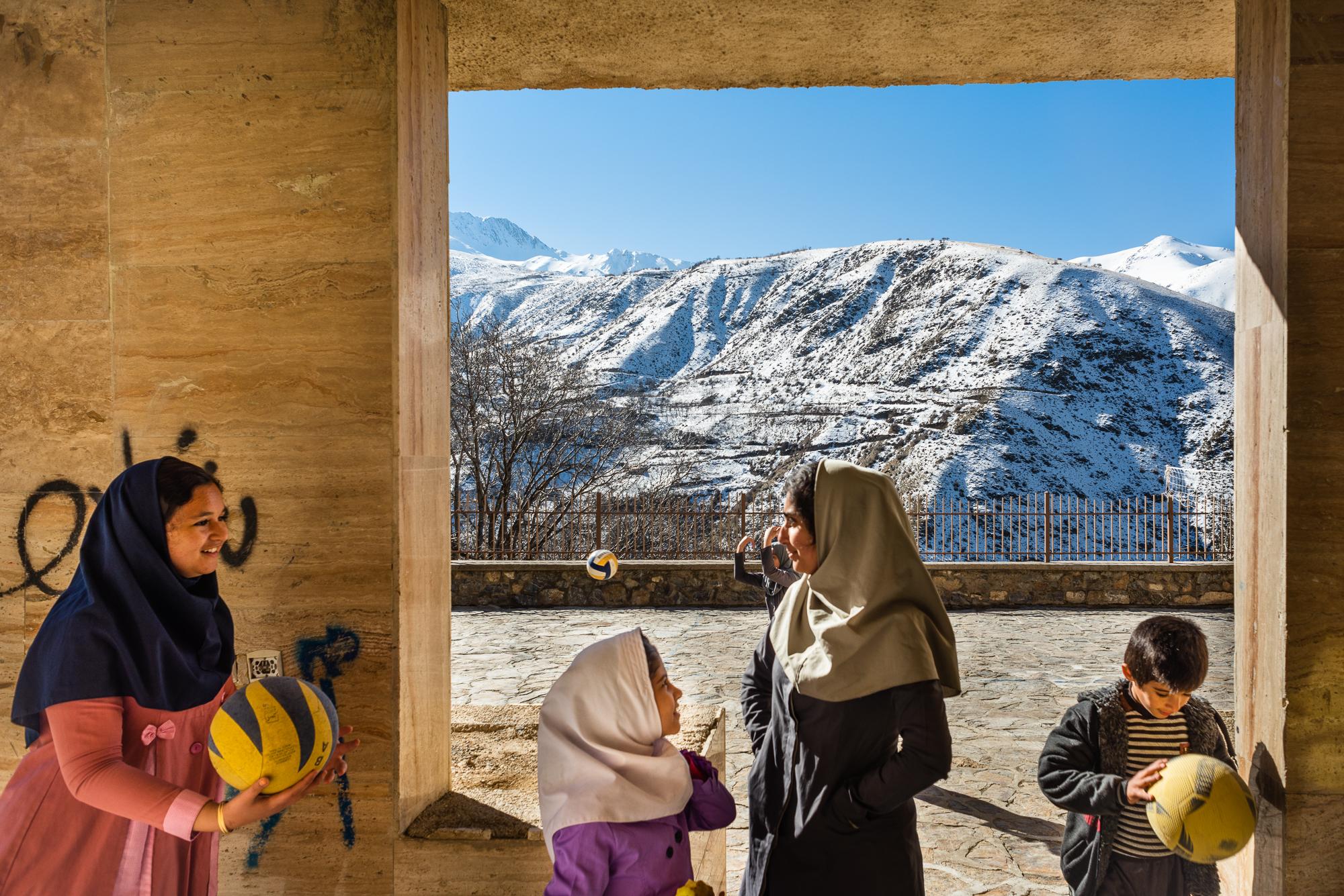 The Other Side of the Mountains - DOLAW, IRAN – FEBRUARY 5, 2019: Kurdish schoolgirls...