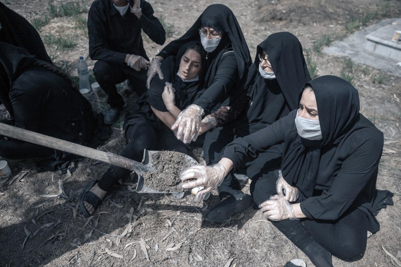 Inside The Living Cell -  Iran- Mazandaran: Women are putting soil on their hands...