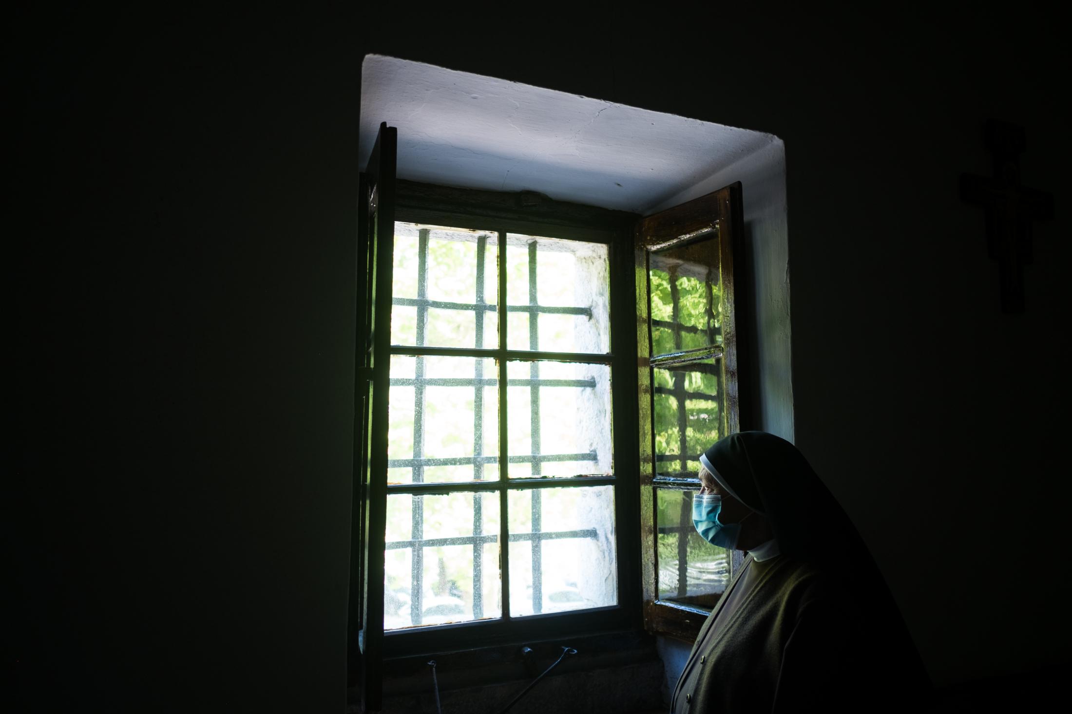 AN OASIS INSIDE THE PANDEMIC -   Sister Genoveva looks out the window of the monastery....