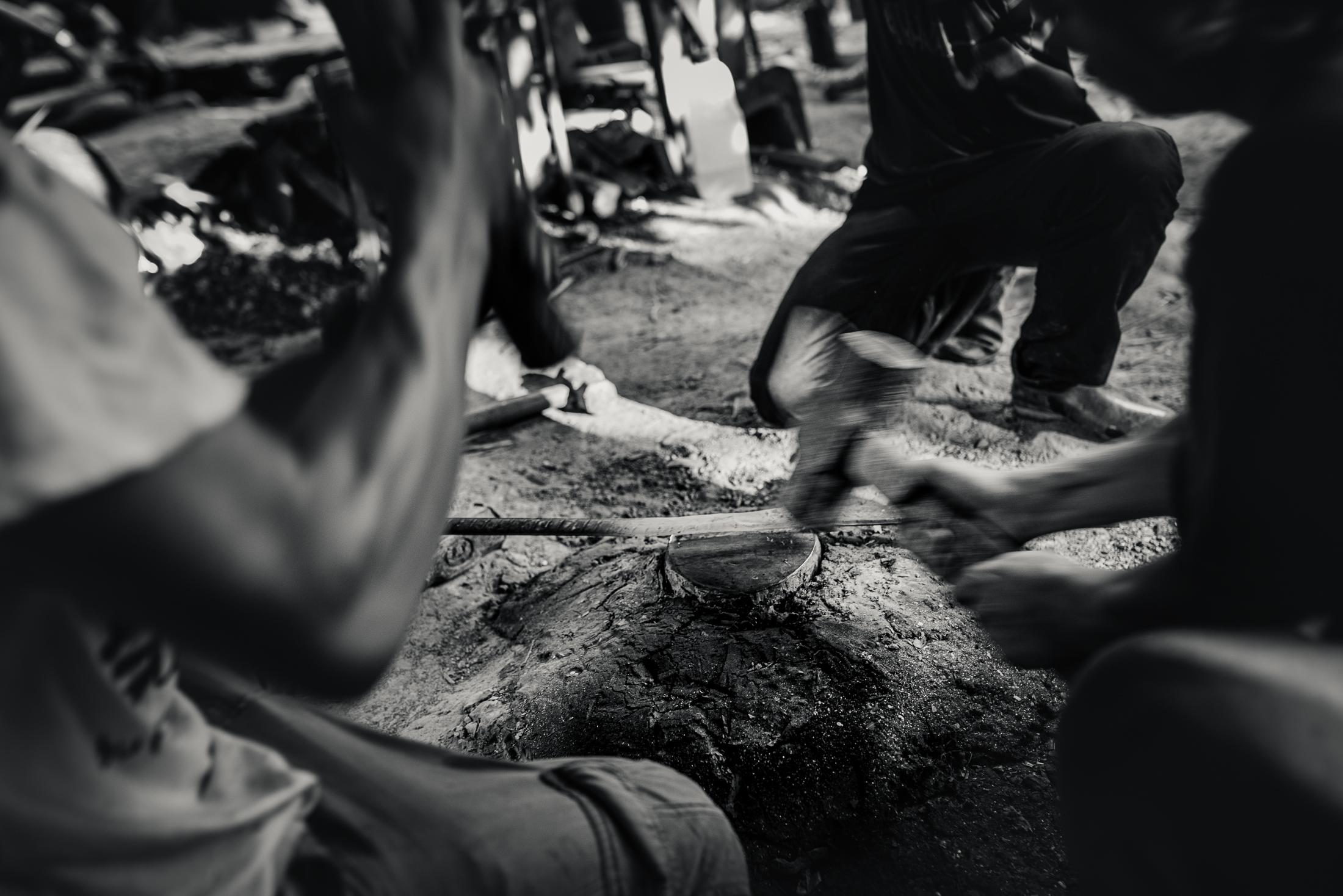 Indigenous Land Rights in Sarawak -  Metal Workers hammer out a parang blade in the Long Beku...