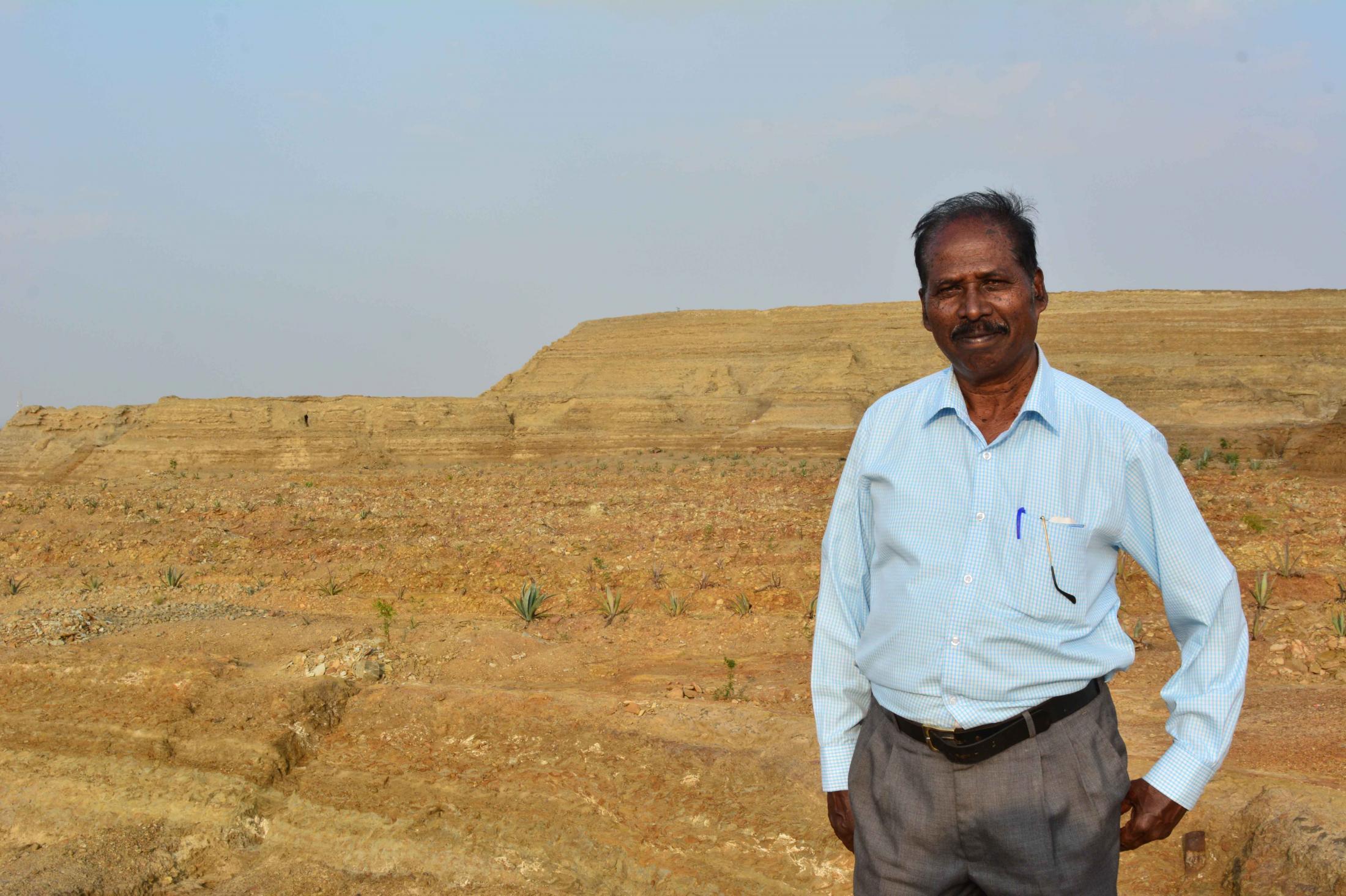 Mr. Selvaraj a miner stands by the cyanide dumps and narrates the history of the mines with pride.