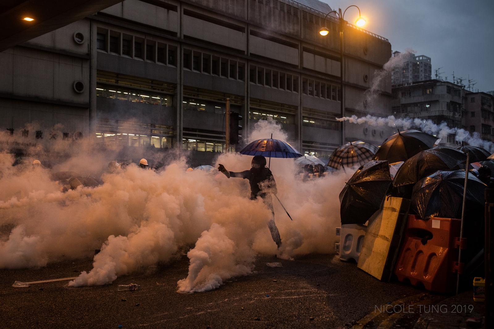 A protestor throws a tear gas c...ands participated. August 2019.
