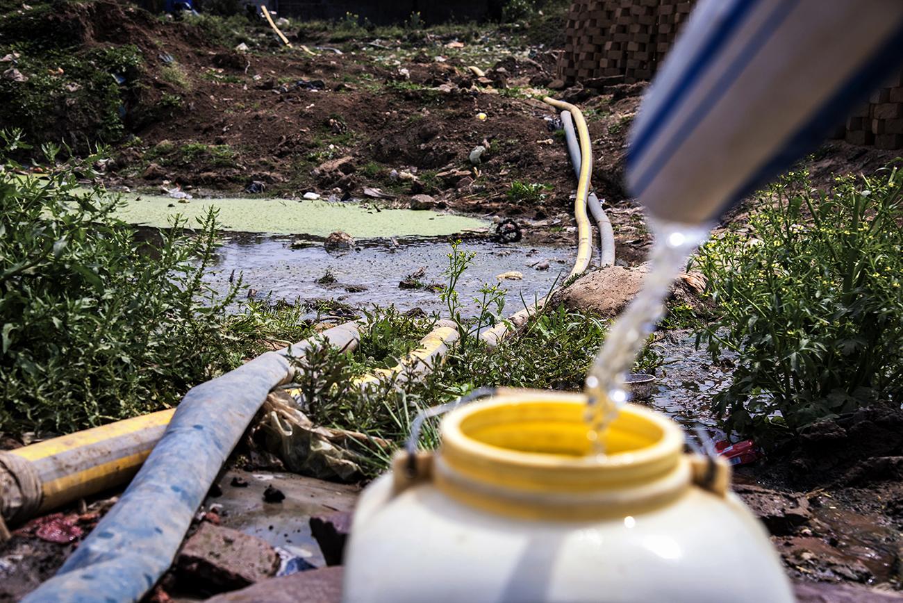 Migrant workers in Bhopal - Polluted water near a handpump at kolhua
