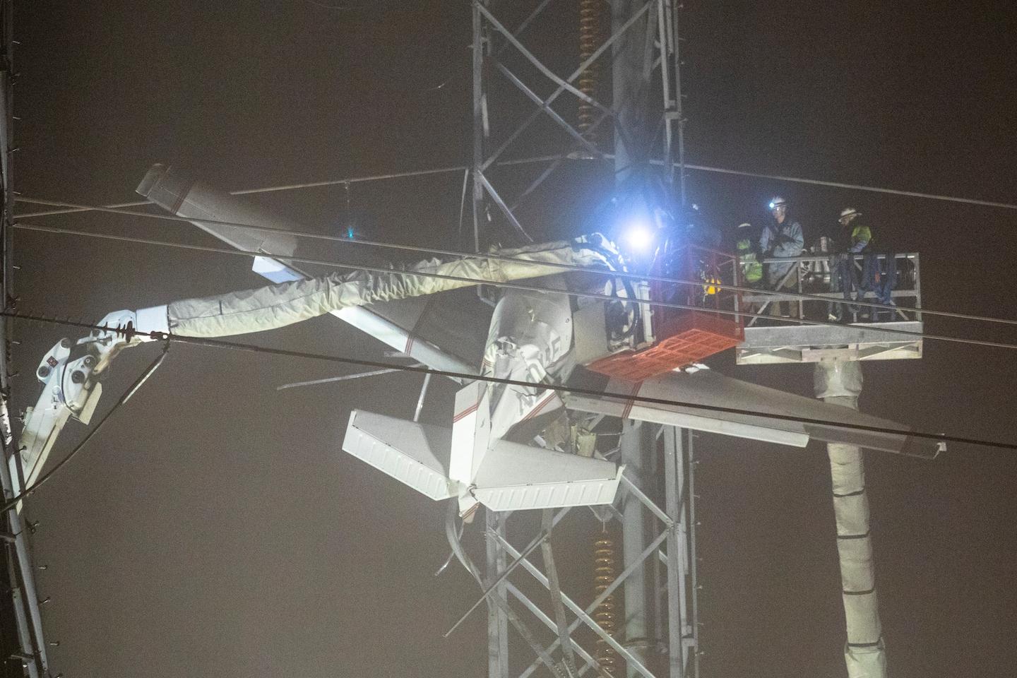 Thumbnail of Pilot, passenger rescued after plane gets tangled in high-voltage lines in Maryland