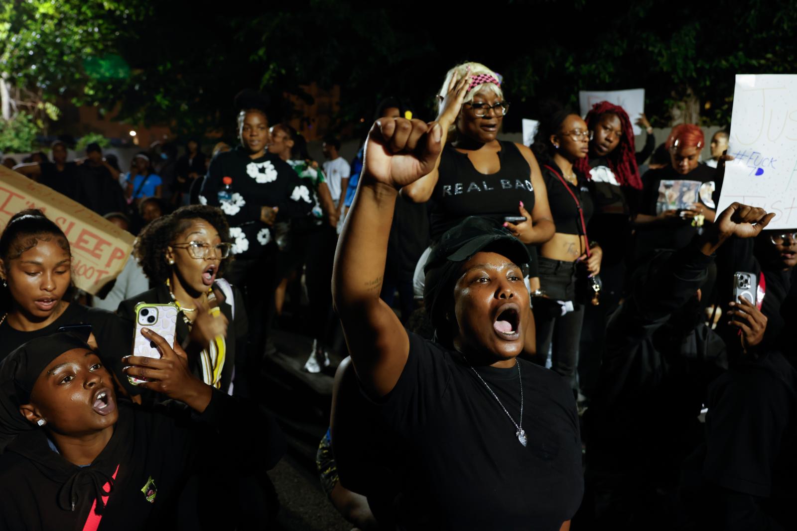 A crowd of protestors at the Mc...shot and killed by D.C. police.