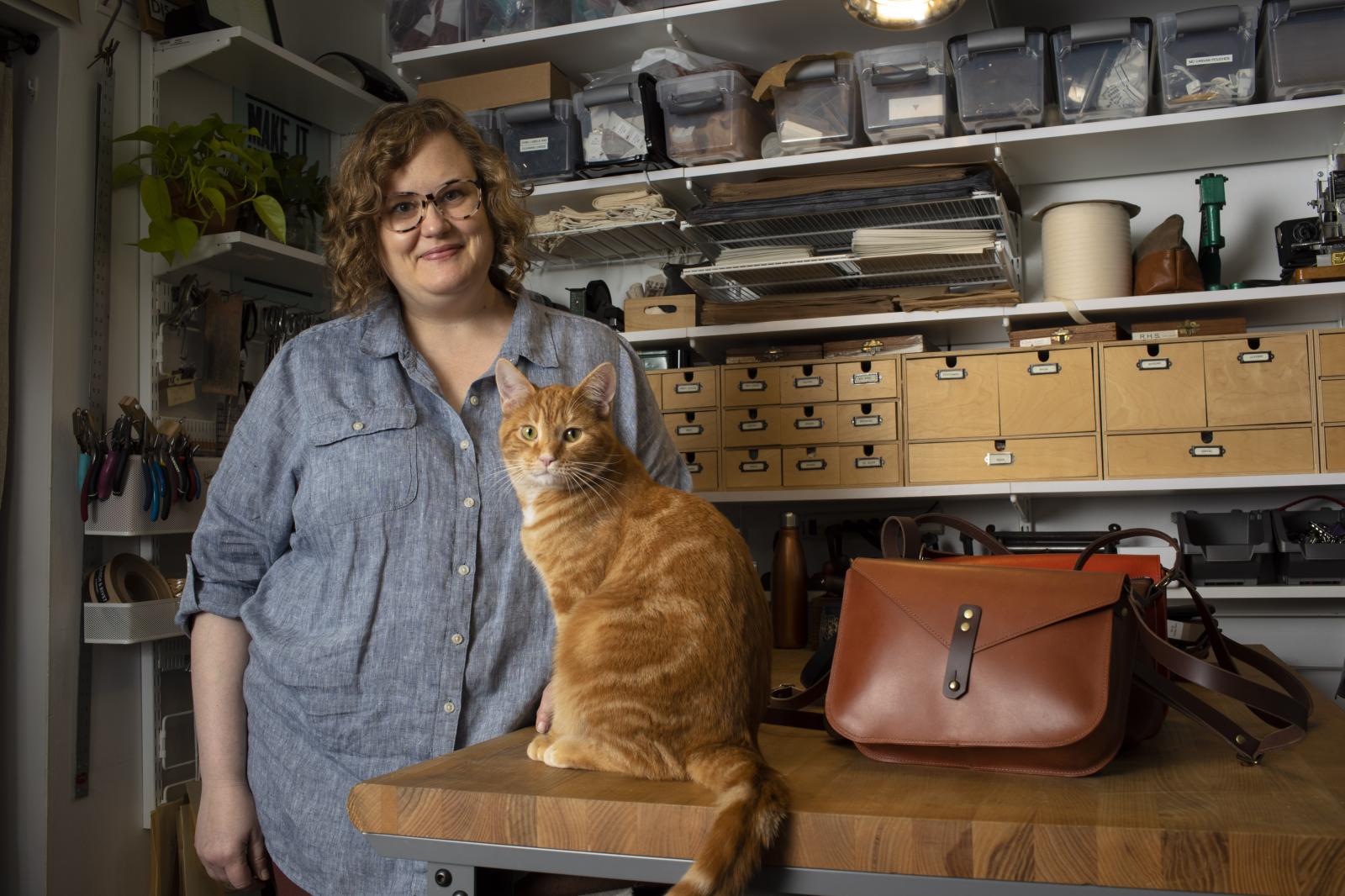 Katie Stack in her workshop where she hand makes leather bags. 
