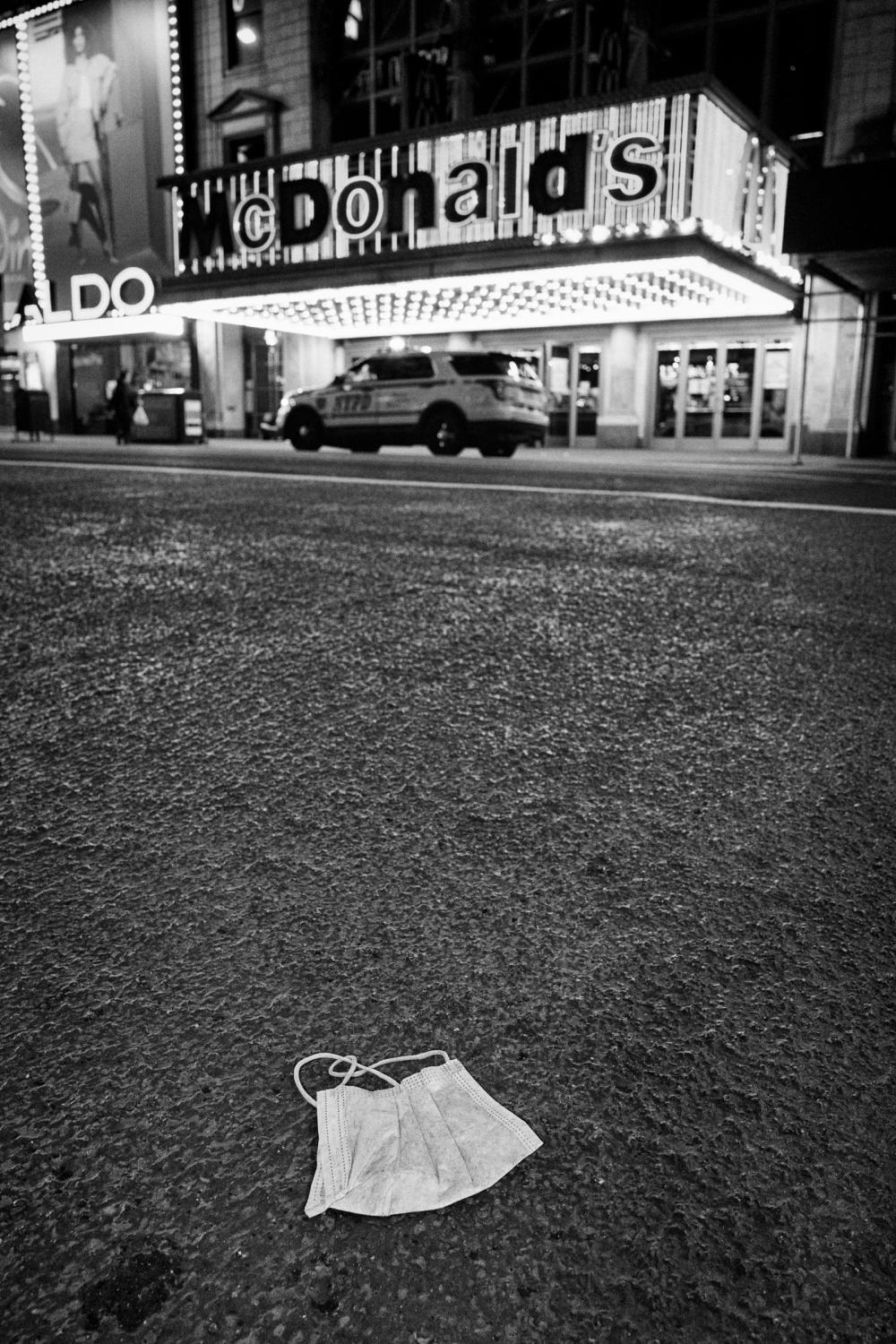 Dire Silence: NYC in Pandemic -  A disposed facial mask is shown on 42nd St., Manhattan,...