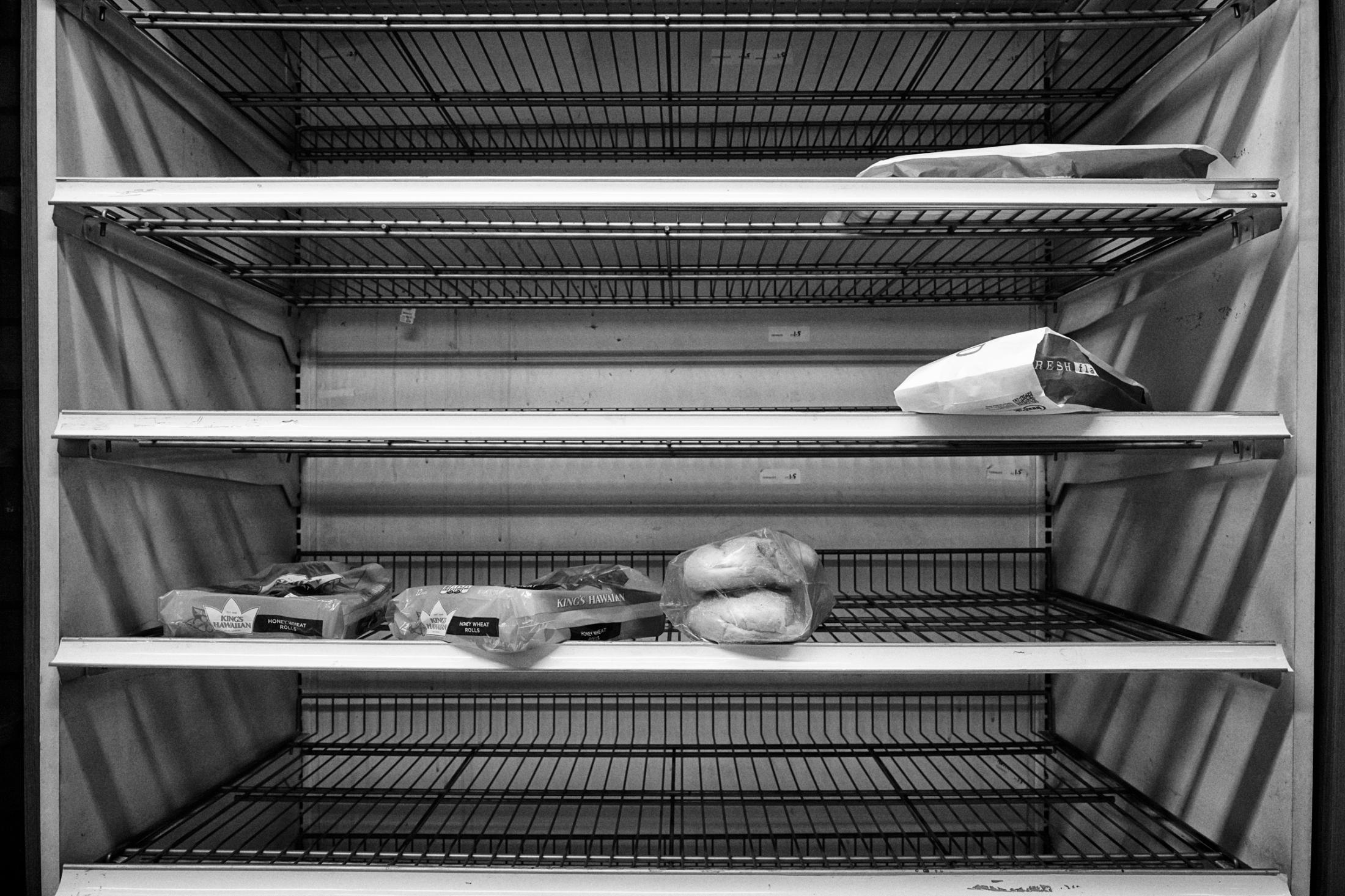 Dire Silence: NYC in Pandemic -  Empty breads shelves in Food Emporium on 42nd St. 10th...