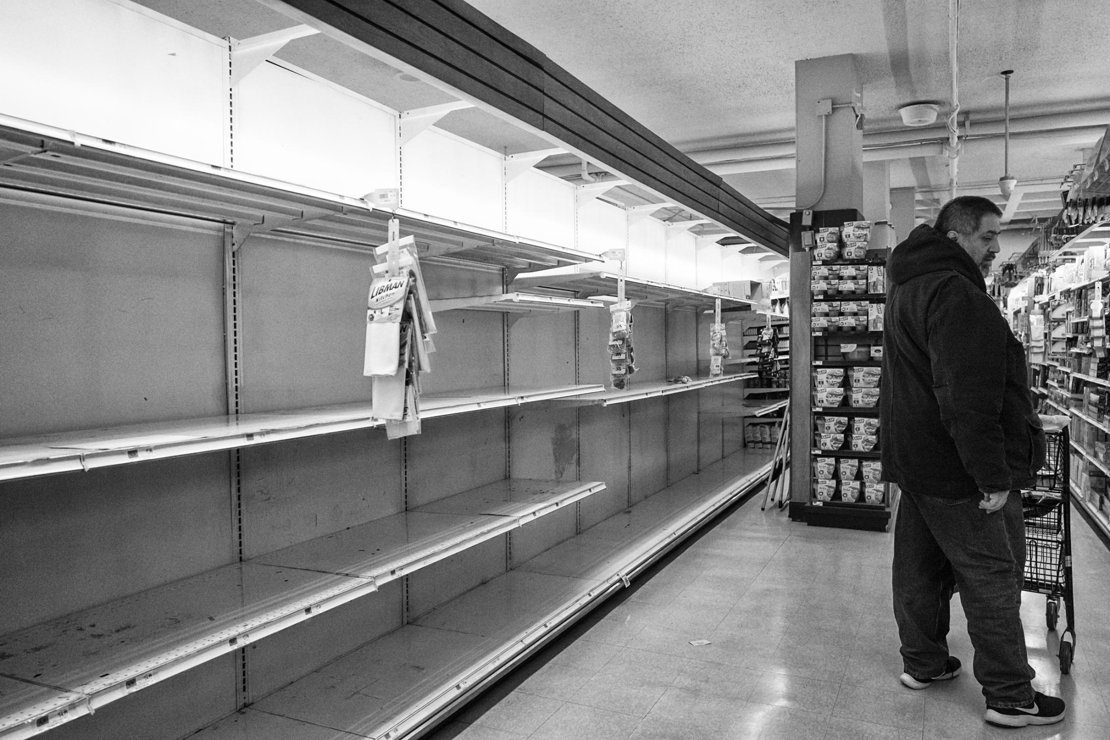 Dire Silence: NYC in Pandemic -  Empty paper products shelves in Food Emporium on 42nd...