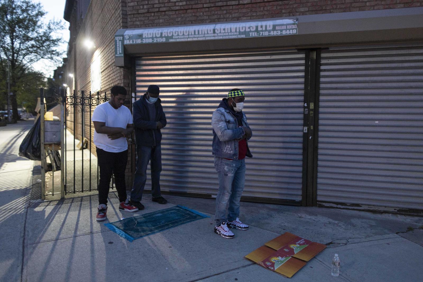 A group of muslim men praying M...e Pandemic, Brooklyn, New York.