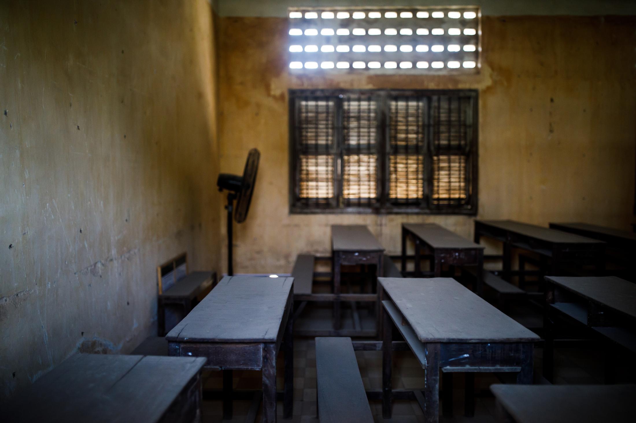  Former classroom inside the Tuol Sleng Genocide Museum. Before the building were used as a secret facility for detention, interrogation, torture and extermination of the political enemies of the regime it was as a school. Between April of 1975 and January of 1979, the Khmer Rouge regime was responsible for the death of about 2 million people in Cambodia, in one of the most lethal regimes of the 20th century. 2019 marked the 40th anniversary of the fall of the Khmer Rouge regime. Phnom Penh, Cambodia. 