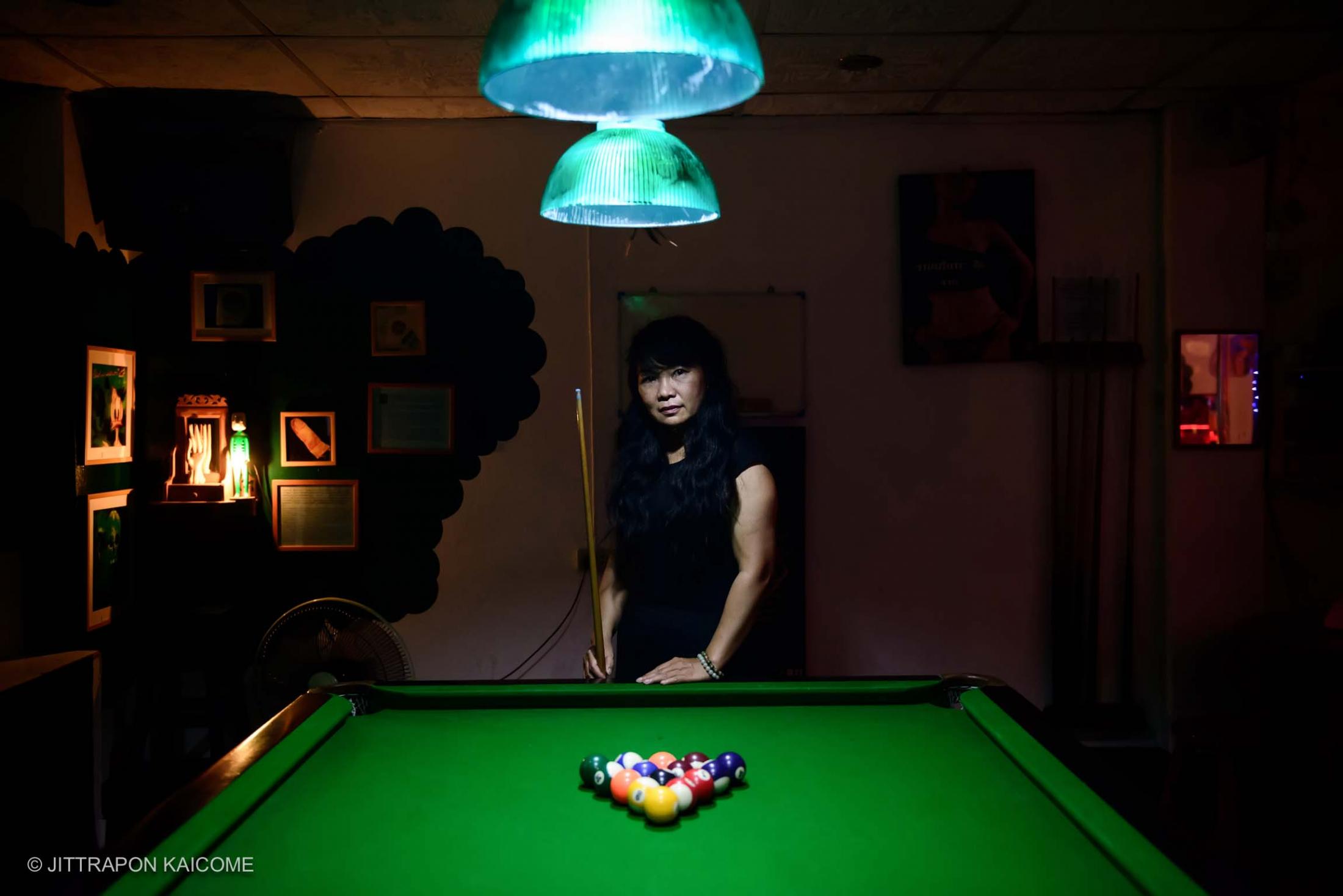 Madam Ping Pong, a sex worker at the bar. Working as a coordinator for Empower, managing a public performance about sex workers and human rights defender for sex workers in Thailand.