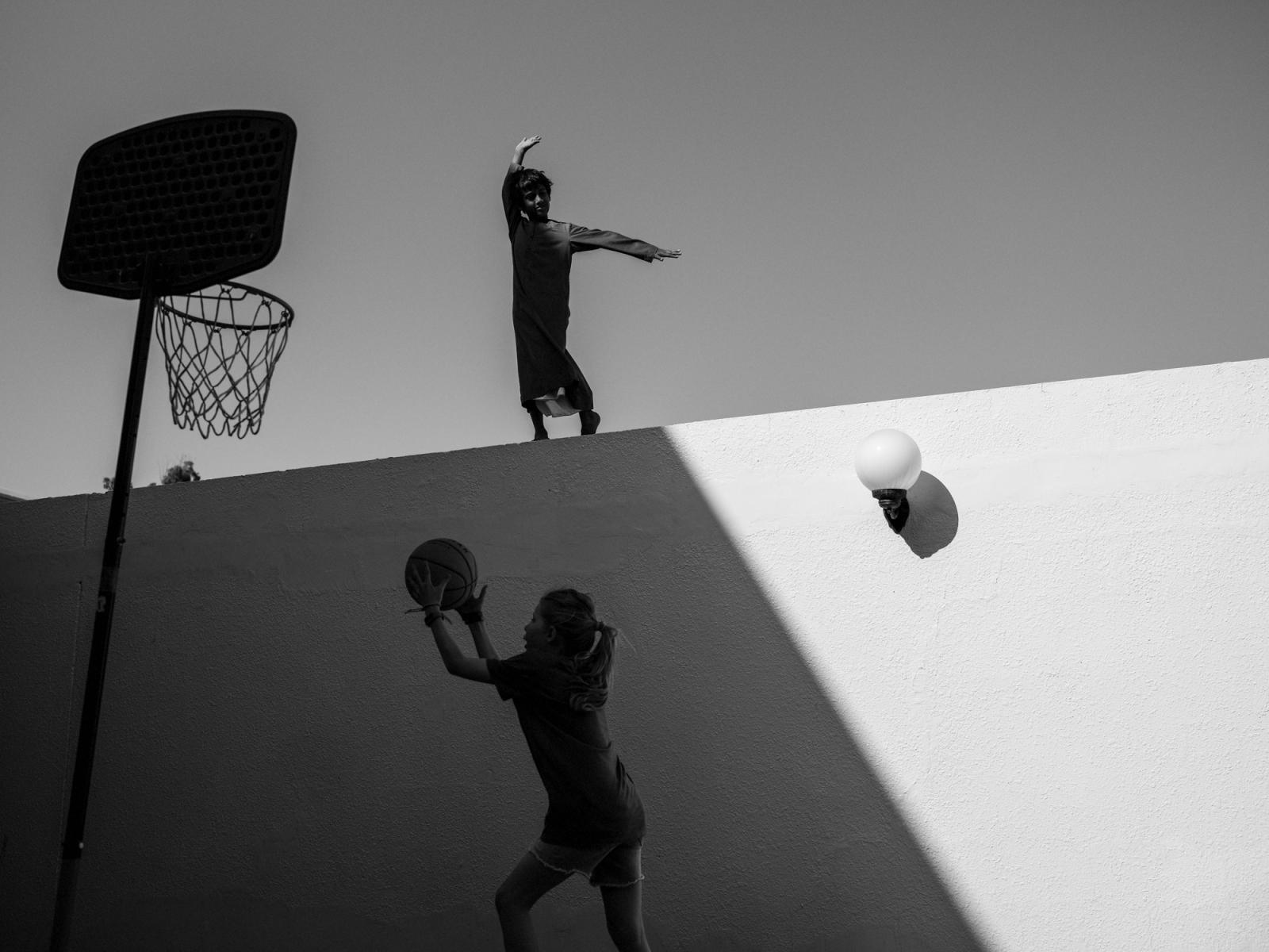 Zayed and Astrid playing basketball