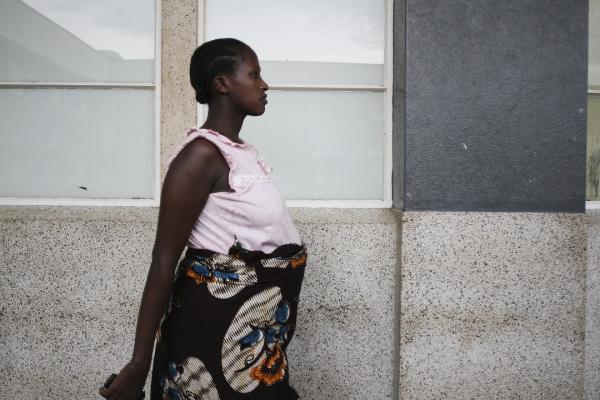 Image from 2012 NEWS CATEGORY WINNERS -  Moses Wasswa  3rd Place, News Story  A woman takes a...